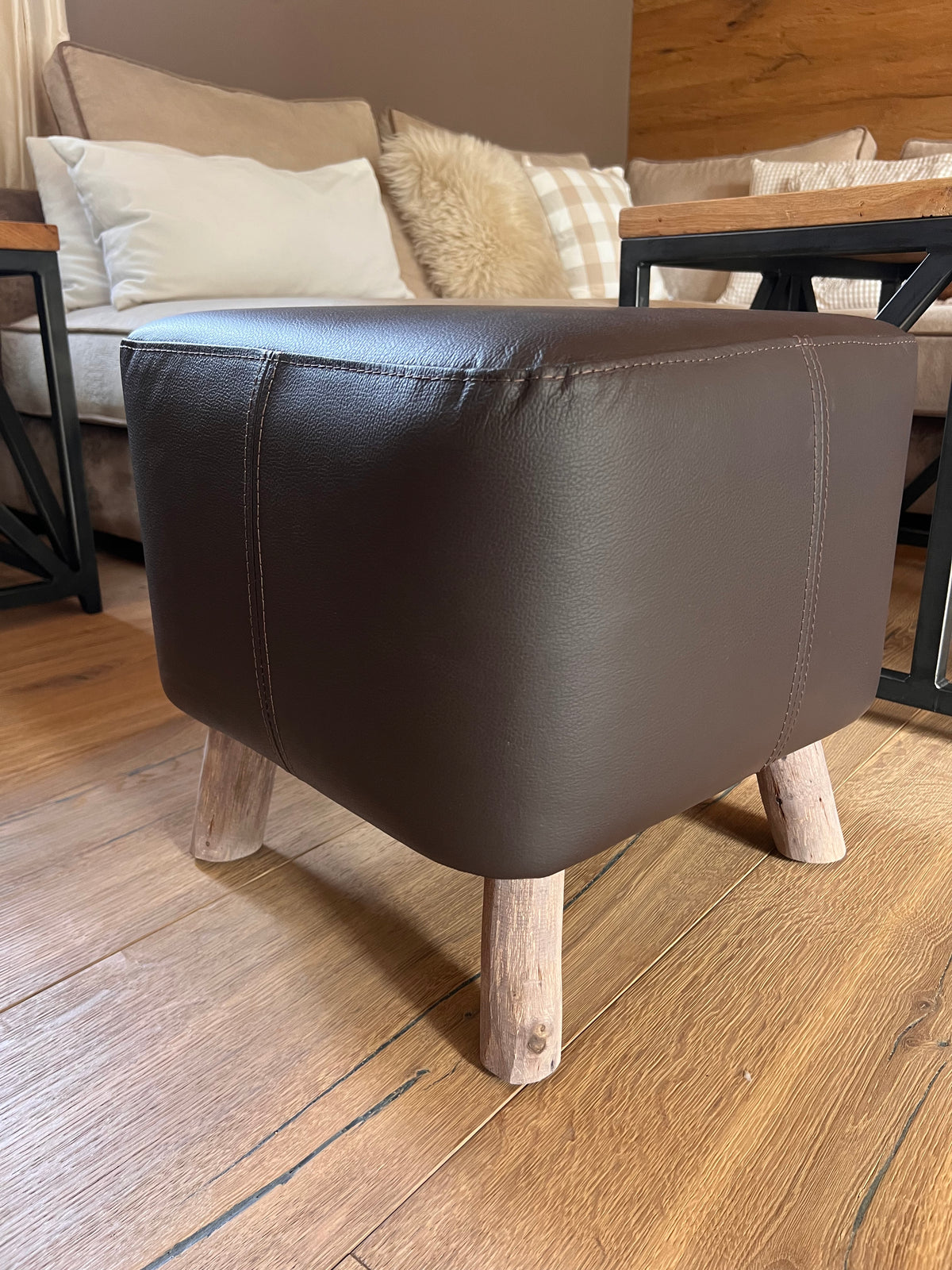 Hocker aus dunkelbraunem Leder