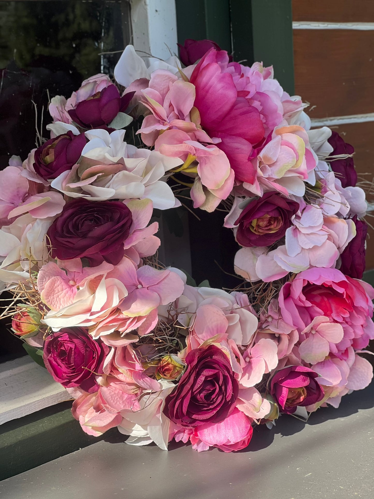 Frühlingskranz aus täuschend echten Blüten