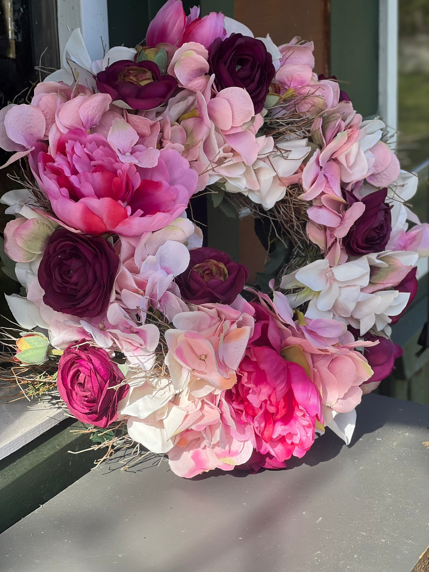 Frühlingskranz aus täuschend echten Blüten